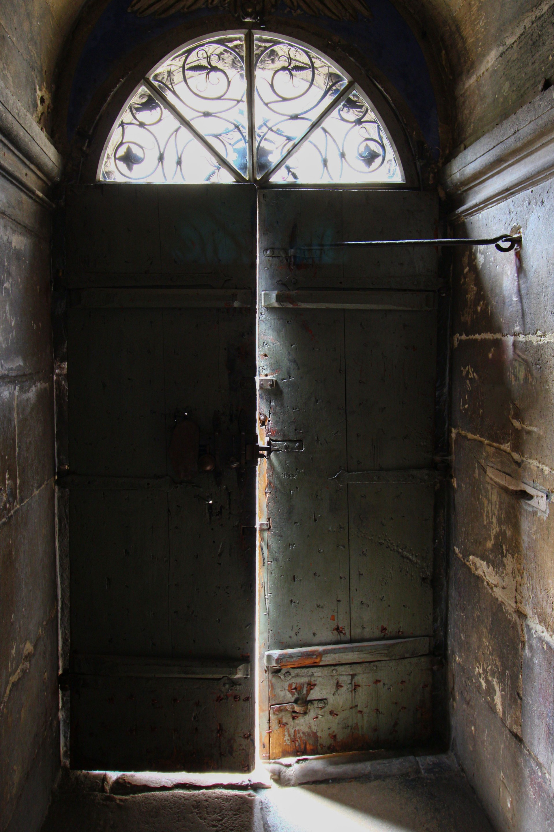 Old doors and light through the gap