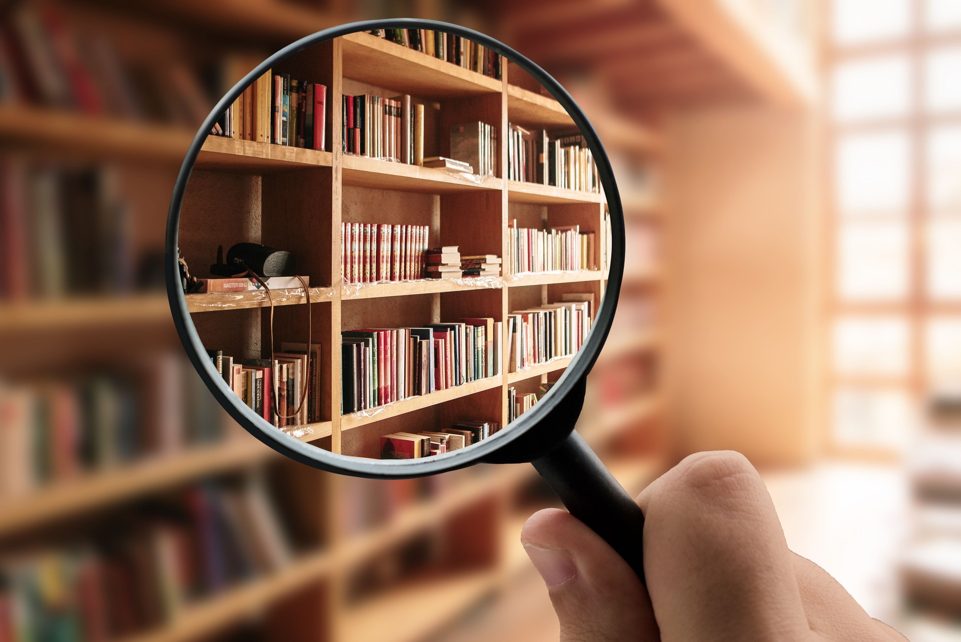 Magnifying glass focusing a library